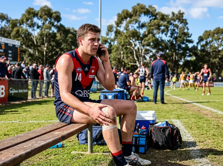 Athlete calling for urgent physiotherapy appointment for sports injury