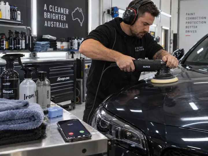 Car detailer unable to answer phone during paint correction work