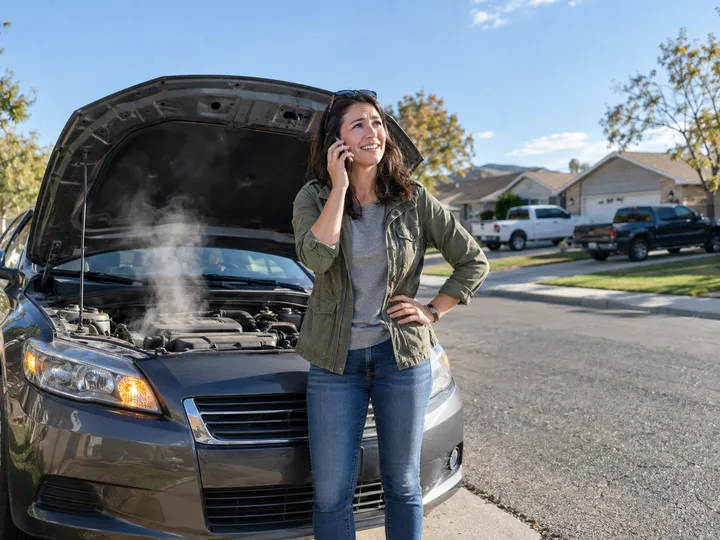 Emergency breakdown call being handled by AI answering service for auto shop