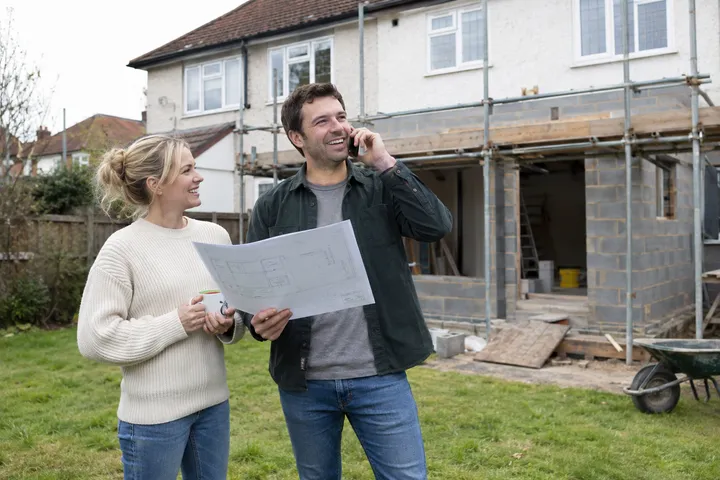 Homeowner calling about an addition quote while contractor is on the job site