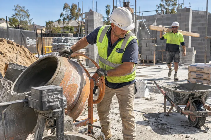 Builder operating machinery while AI handles incoming phone call