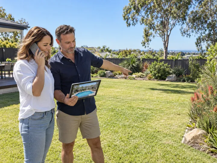 Homeowners enquiring about a new swimming pool installation