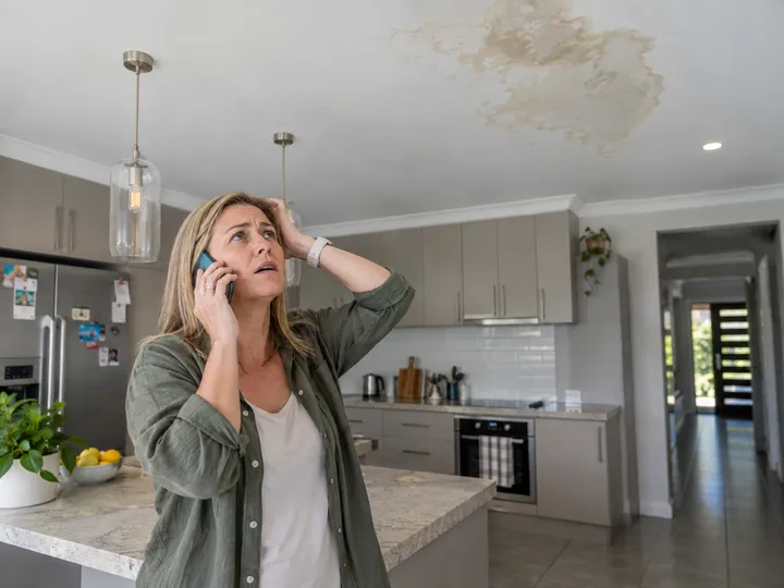 Homeowner urgently calling tradie about water damage